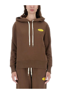 Brown hooded sweatshirt with cream drawstrings and yellow oval logo on chest from AUTRY women’s collection