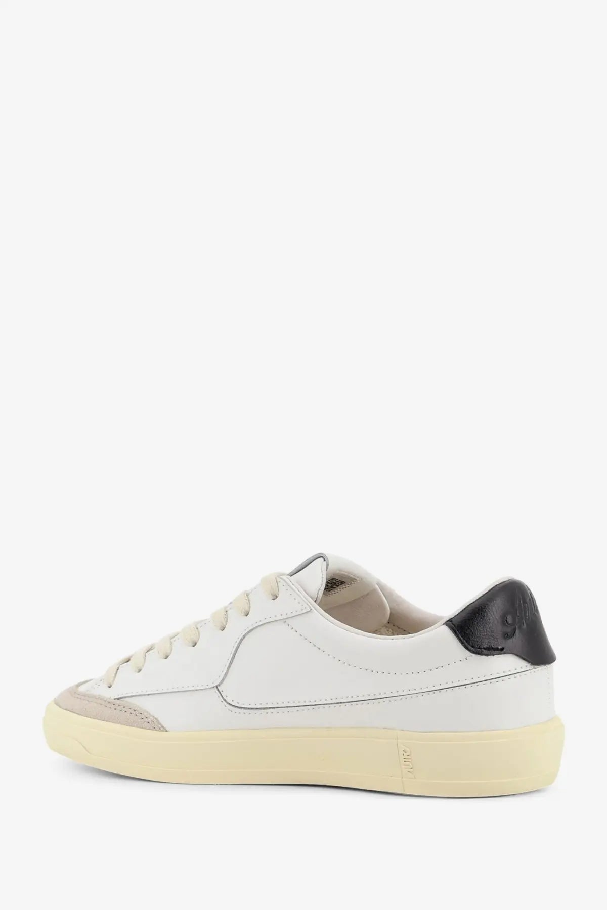 Autry women’s Windscape leather sneakers in white with black rubber heel tab and beige low-top sole back view