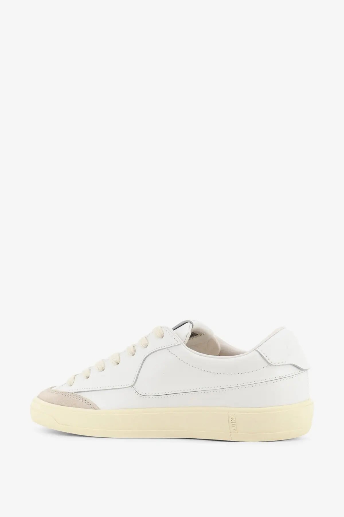 Autry women’s windscape leather sneaker in white with beige rubber toe cap and sole featuring a minimalist design