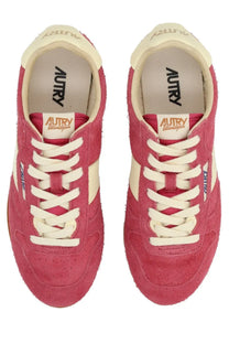 Autry women’s windspin low sneaker in pink suede with cream laces and retro design accents