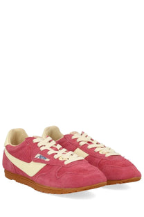 Autry women’s windspin low sneaker in pink suede with cream stripe and brown rubber sole