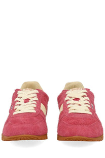 Autry women’s windspin low sneaker in pink suede with cream laces and tan rubber sole