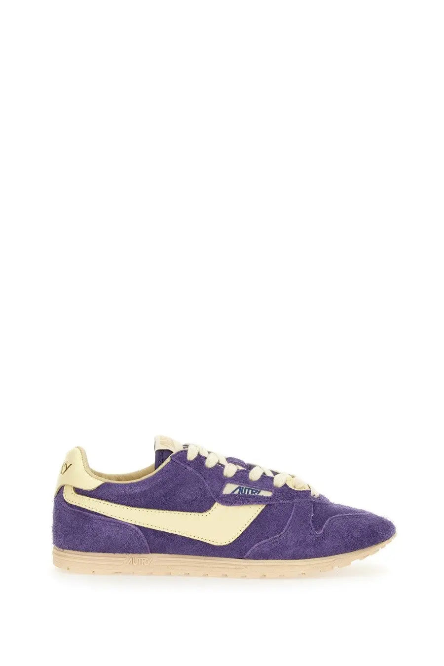 Autry women’s windspin low sneaker in purple suede with cream accents and laces featuring a classic retro design