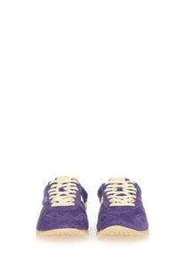Autry women’s windspin low sneaker in purple suede with cream-colored laces and soles