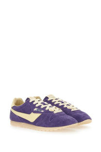 Autry women’s windspin low sneaker in purple suede with cream accents and laces featuring a retro design