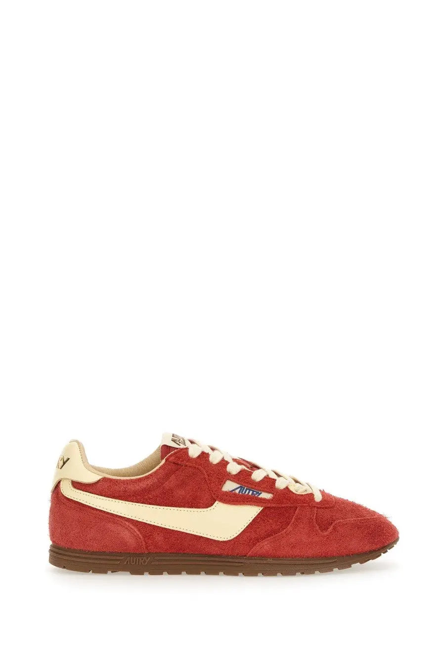 Autry women’s windspin low sneaker in red suede with cream accents and brown rubber sole visible from the back side