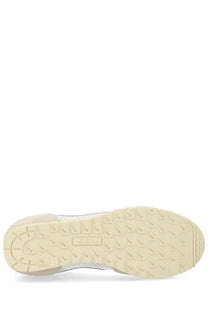 Cream-colored rubber sole with textured geometric tread and Autry embossed near the heel on the windspin sneaker back side