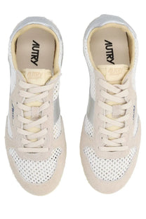 Beige and silver mesh autry women’s windspin sneakers with suede accents and autry logo on the insole