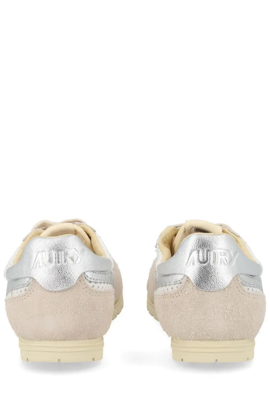 Beige suede autry women’s windspin sneakers with silver metallic heel tabs and cream rubber soles back view