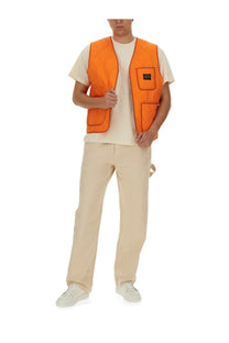 Bright orange quilted vest with black zipper and pockets from awake ny mens vests collection
