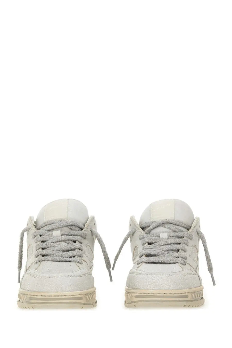 A pair of off-white axel arigato men’s area lo sneakers with gray laces and chunky soles