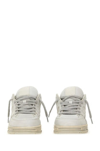 A pair of off-white axel arigato men’s area lo sneakers with gray laces and chunky soles