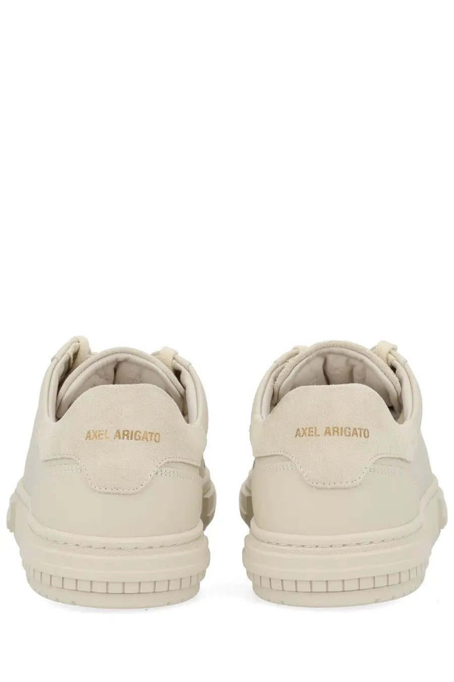 Back view of cream-colored suede axel arigato men’s atlas sneaker with chunky sole and gold-tone branding on heel