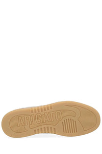 Tan rubber sole of axel arigato men’s says toe sneaker grey with embossed arigato branding and textured grip patterns