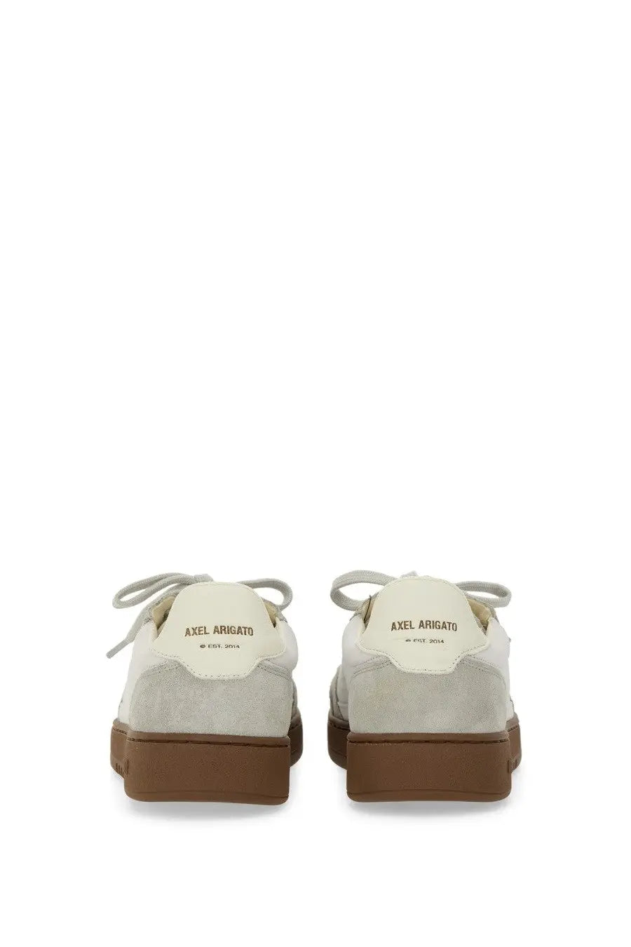 Cream-colored suede low-top axel arigato men’s says toe sneaker with brown rubber soles and matching laces back view