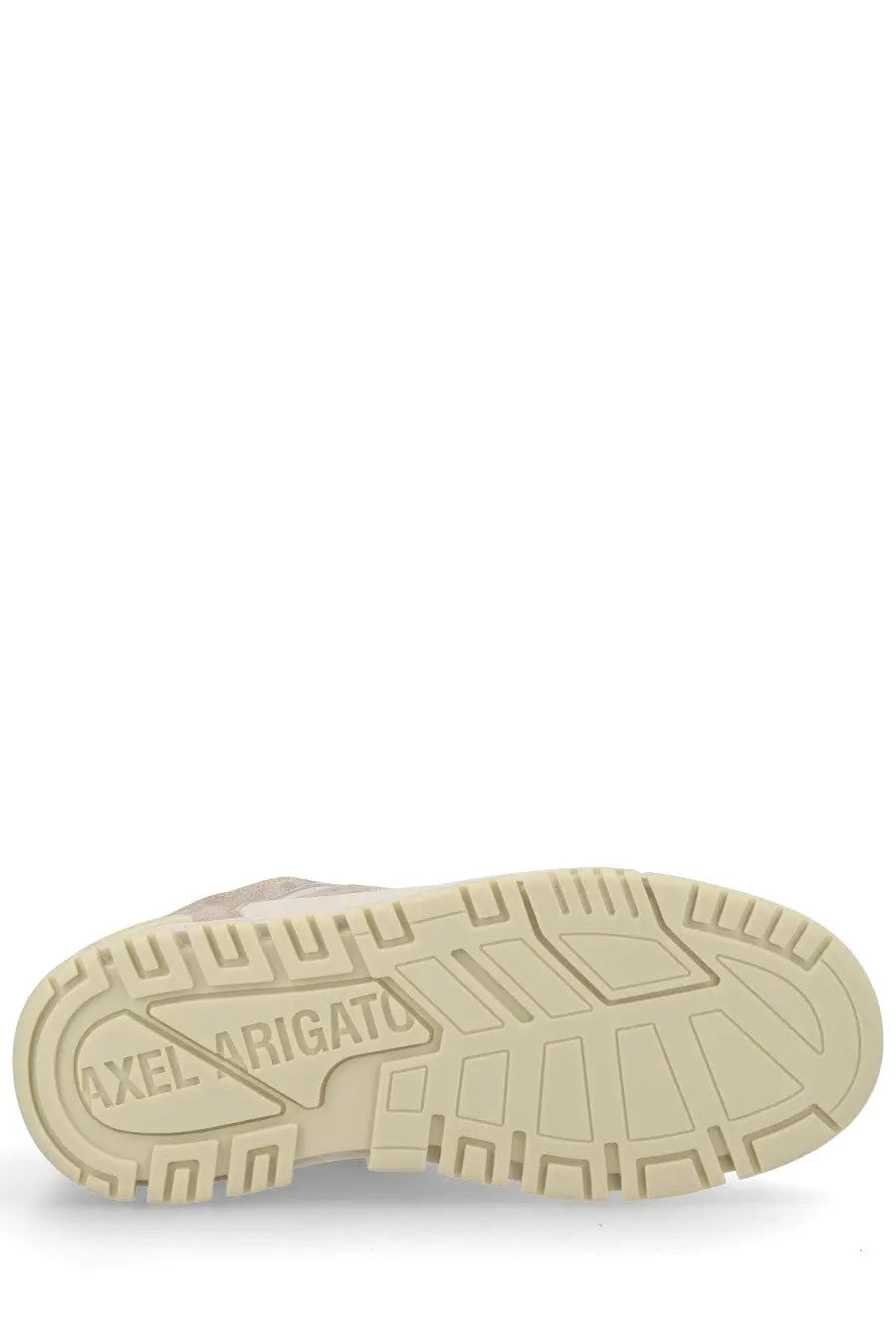 Beige rubber sole of axel arigato men’s sneaker area with embossed shield-shaped logo on the back side