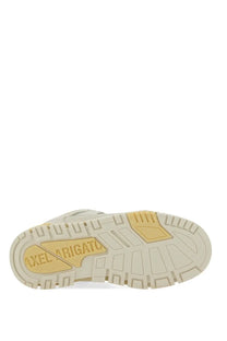 Back view of cream-colored Axel Arigato men’s sneaker area green with textured rubber sole and yellow branding on heel