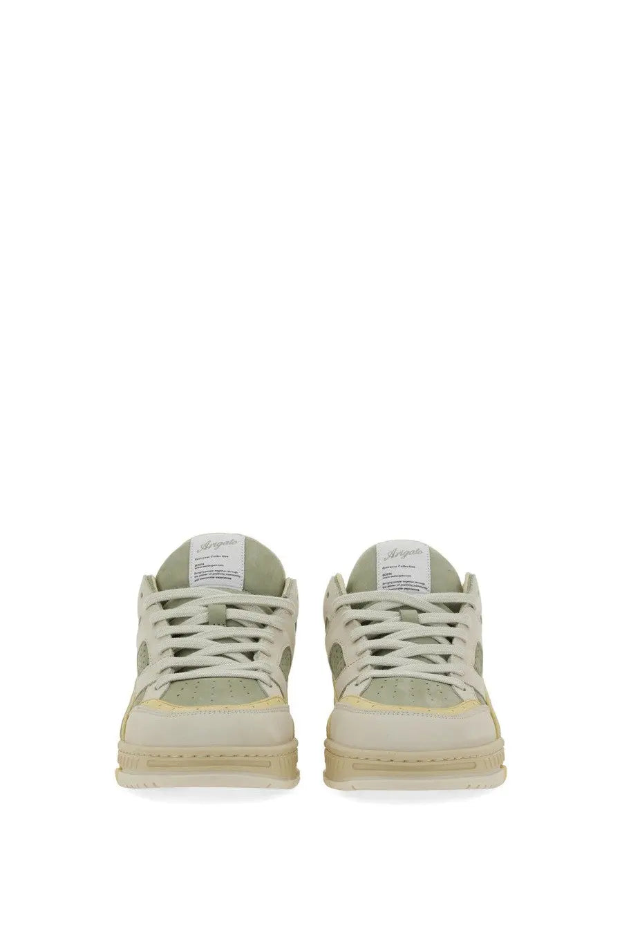A pair of beige and pale green axel arigato men’s low-top sneakers with a clean minimalist design