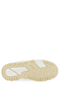 Back view of axel arigato men’s sneaker area white with beige rubber sole white midsole and branding on heel