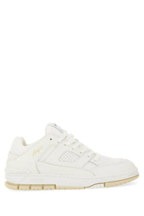 Axel Arigato men’s sneaker area white white leather sneaker with subtle gold branding and beige rubber sole