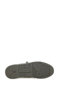 Gray rubber sole with textured tread pattern and embossed axel arigato logo on men’s sneaker clay grey