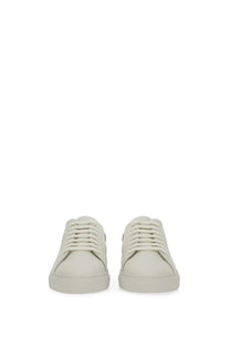Axel Arigato men’s sneaker clean white cream-colored leather low-top with minimalist design and white laces