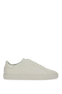 Axel Arigato men’s sneaker clean white cream-colored suede low-top with minimalist design and subtle stitching details
