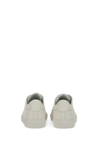 Axel Arigato men’s sneaker clean white minimalist off-white leather sneakers with clean stitching and low-profile sole