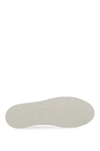 Axel arigato men’s sneaker clean white with white rubber sole featuring subtle vertical grooves and minimalist design