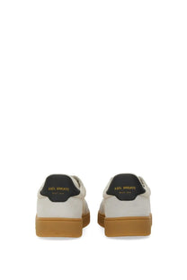 Axel Arigato men’s sneaker dice white leather with black heel tabs tan rubber soles and gold lettering on the back