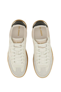 Axel Arigato men’s sneaker Dice white in white leather with tan rubber soles black heel accents and gold branding