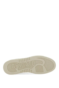 Cream-colored rubber sole with embossed arigato branding and textured grip on axel arigato men’s sneaker says beige