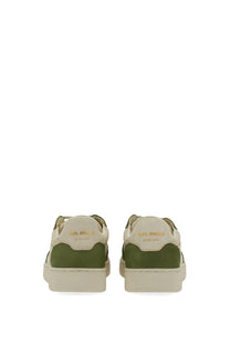 Axel Arigato men’s sneaker says beige low-top with olive green and cream suede panels and chunky rubber sole