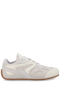 Axel Arigato men’s sneaker slow runner white cream-colored with suede and synthetic geometric cutouts and gum sole