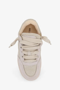 Beige canvas low-top sneaker with matching laces and chunky sole axel arigato women’s area loop suede white