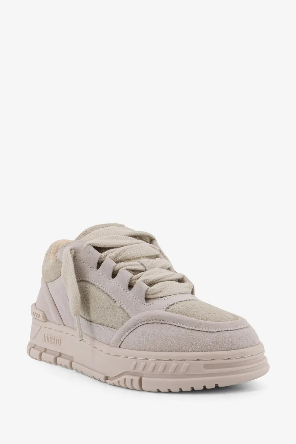 Beige suede low-top sneaker with chunky rubber sole and subtle heel branding from axel arigato women’s area loop line