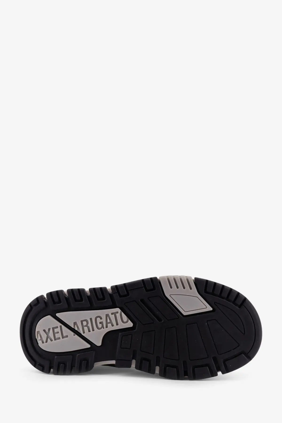 Black rubber sole with silver metallic branding and textured tread pattern on women’s axel arigato leather sneaker