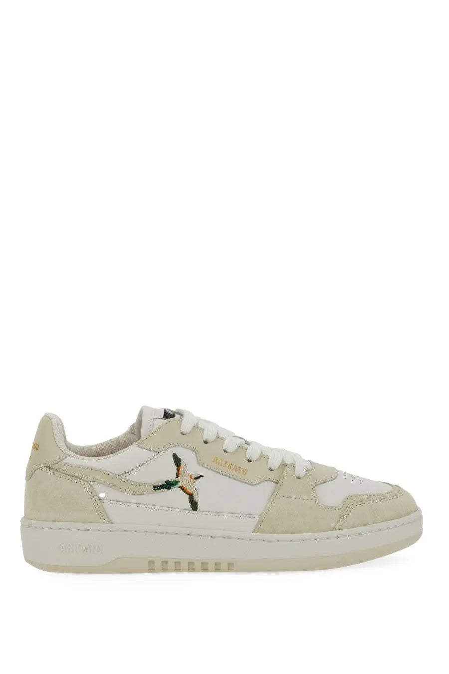 Cream-colored suede and leather low-top sneaker with embroidered bee bird design on the side by axel arigato