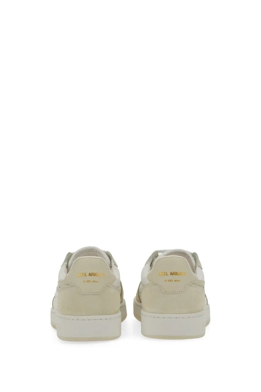 Back side of cream-colored suede axel arigato women’s says lo bee bird sneaker with gold branding on the heel