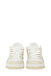 Axel Arigato women’s low-top sneaker in white and beige with a clean minimalist leather design