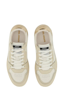 Axel Arigato women’s cream leather sneakers with white laces and gold metallic heel with arigato label inside