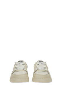 Axel Arigato women’s sneaker says white cream-colored leather sneaker with white laces and minimalist design