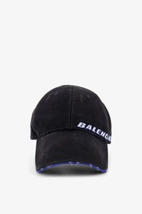 Black distressed cotton baseball hat with embroidered balenciaga logo in white and purple along the brim