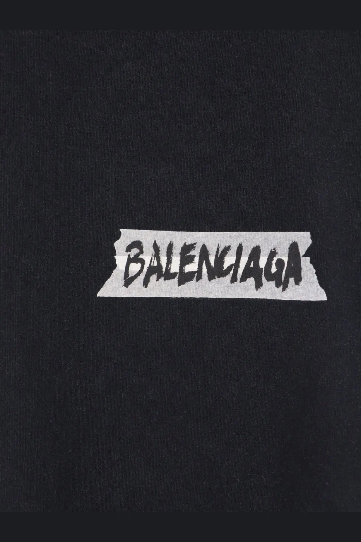 Balenciaga men’s black cotton t-shirt featuring a white tape-sticker logo with bold black lettering
