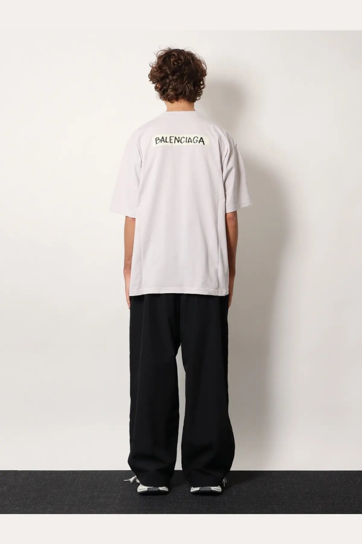 Balenciaga men’s white cotton t-shirt showing the back with black lettering across the back