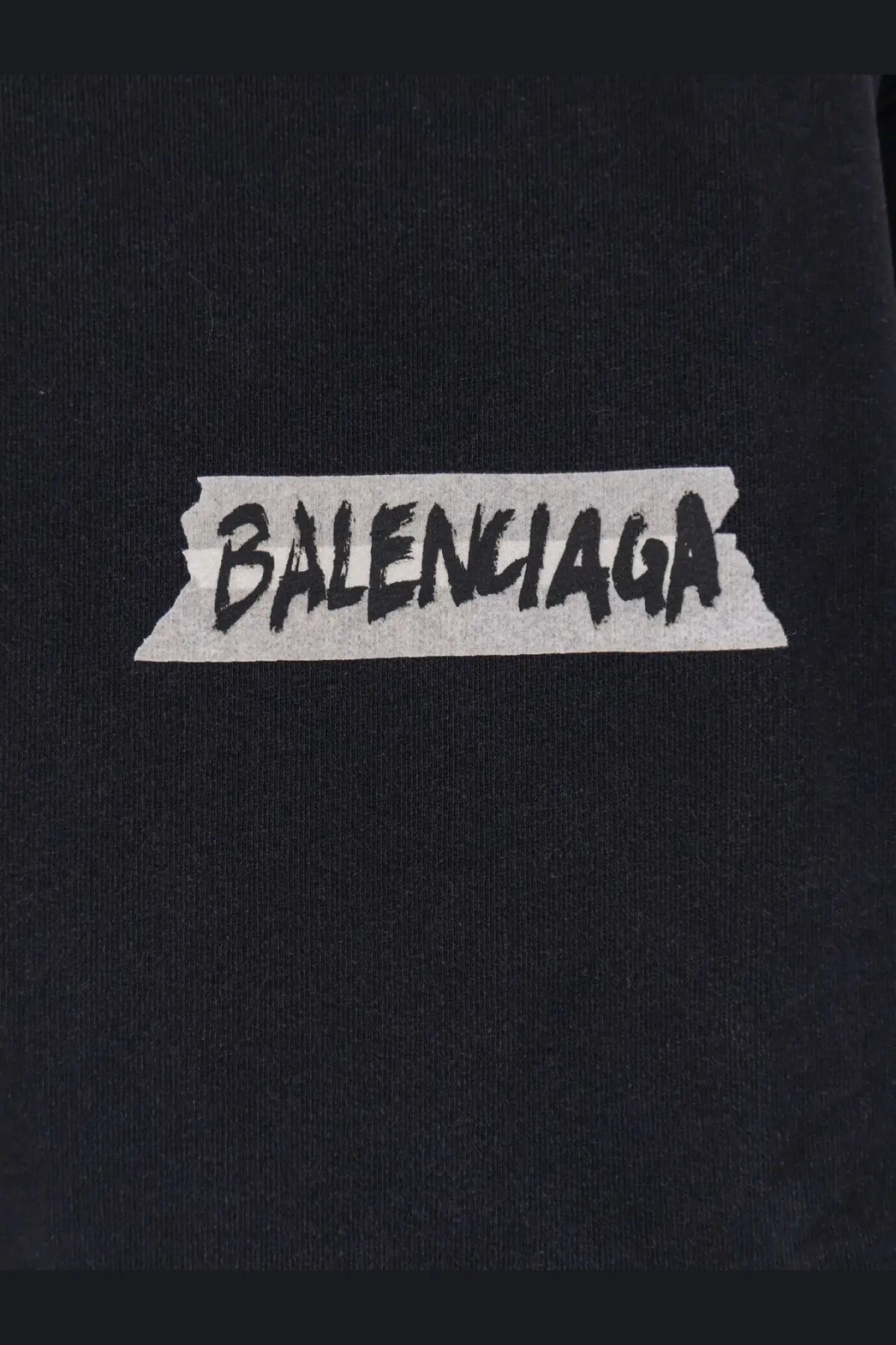 Black balenciaga logo patch with distressed tape design on balenciaga men’s black cotton sweatshirt