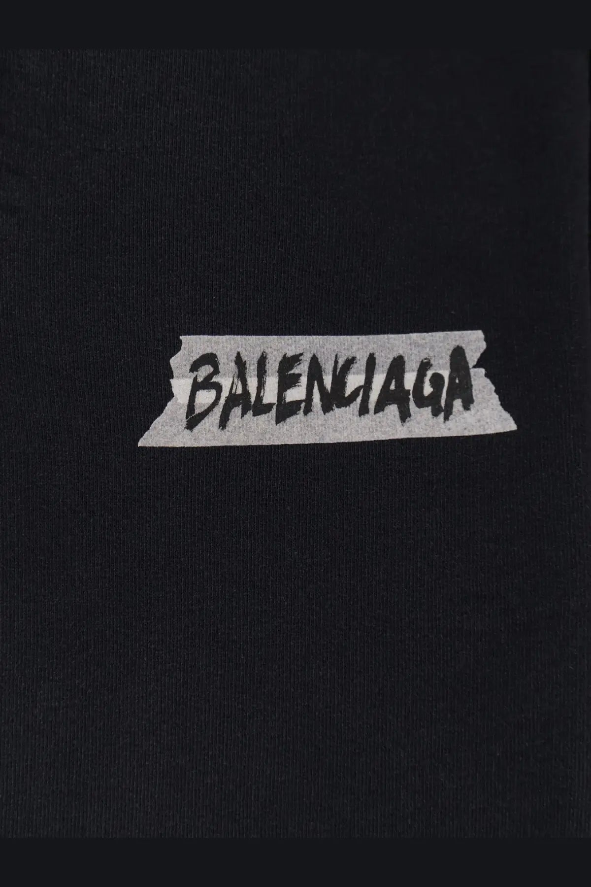 Black Balenciaga men’s cotton sweatshirt featuring a distressed tape-style logo with bold black lettering