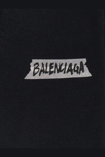 Black Balenciaga men’s cotton sweatshirt featuring a distressed tape-style logo with bold black lettering