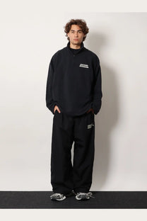Black balenciaga men’s cotton sweatshirt with white logo patch on chest paired with matching black pants