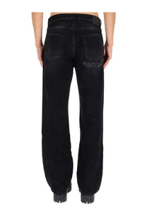 Balenciaga men’s deconstructed black denim jeans back side showing a distressed patch on the right rear pocket